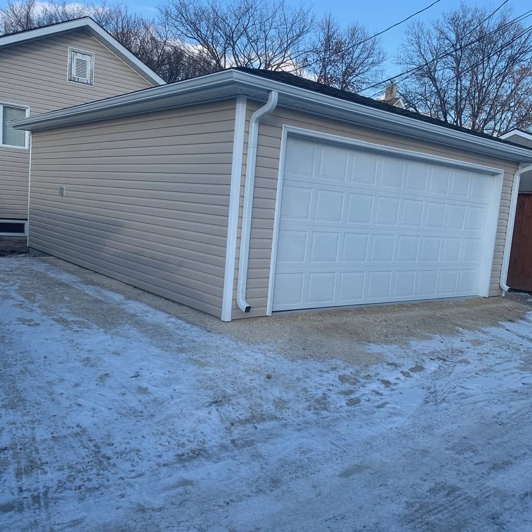 Completed detached garage — vinyl siding, double door, Winnipeg