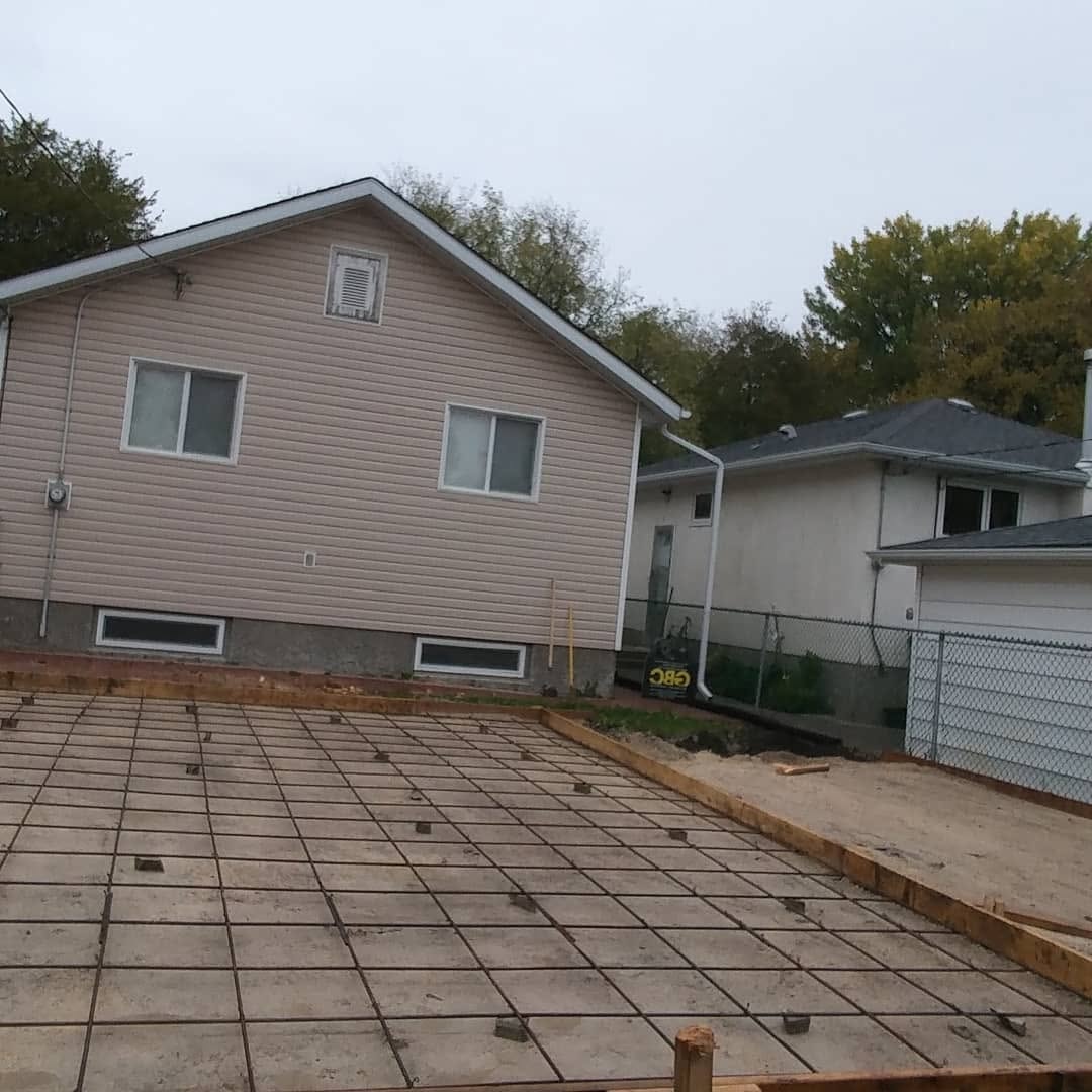 Garage foundation — rebar grid and form boards ready for concrete pour